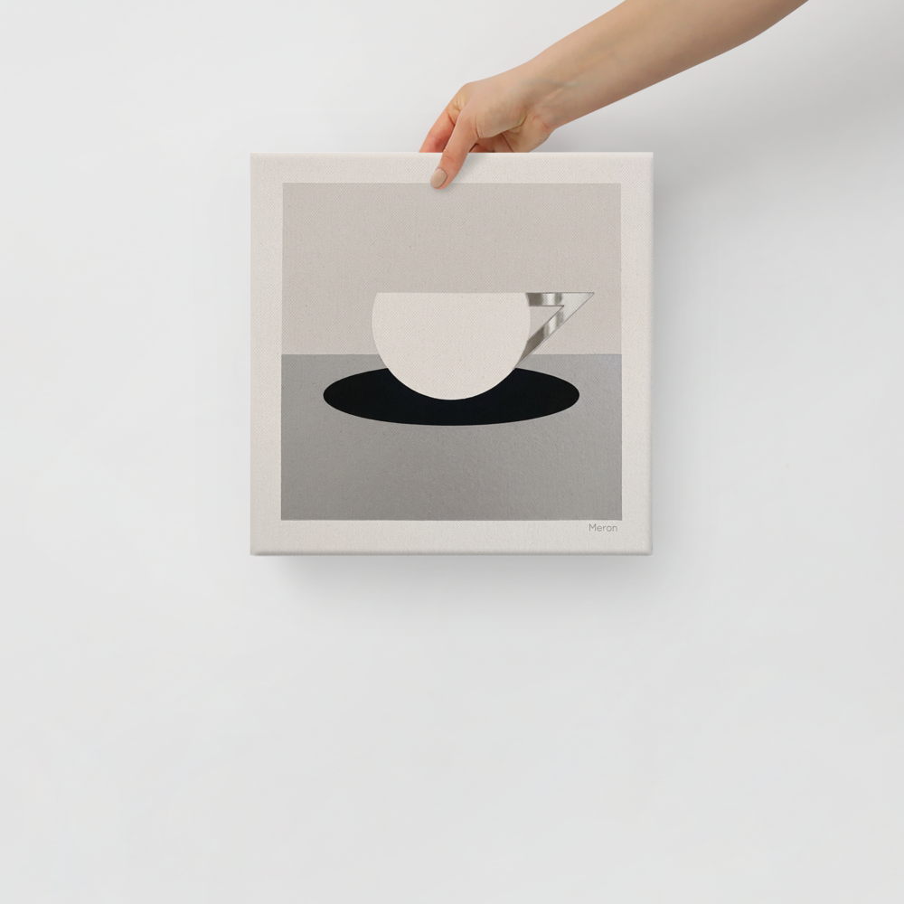 'The Abstract Cup' — a Art Deco print. A minimalist geometric painting of a white cup with an angular silver handle resting on a black oval, ideal for a modern kitchen.