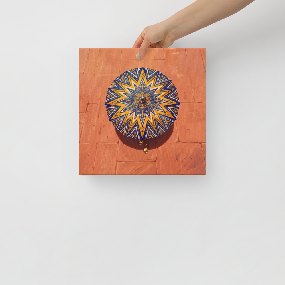 'The Patterned Parasol' — a Geometric abstract art,Figurative art print. Aerial overhead view of a woman walking with an intricate navy and yellow geometric parasol over warm terracotta pavement, ideal for Entryway wall art.