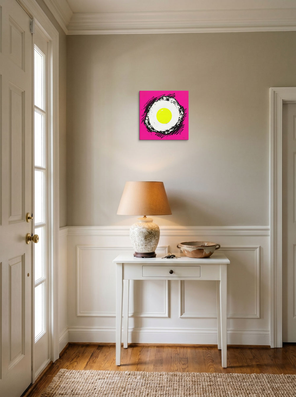 A 12x12 inch canvas Pop art print of 'Sunny Side Pop' hanging in an entryway near a console.