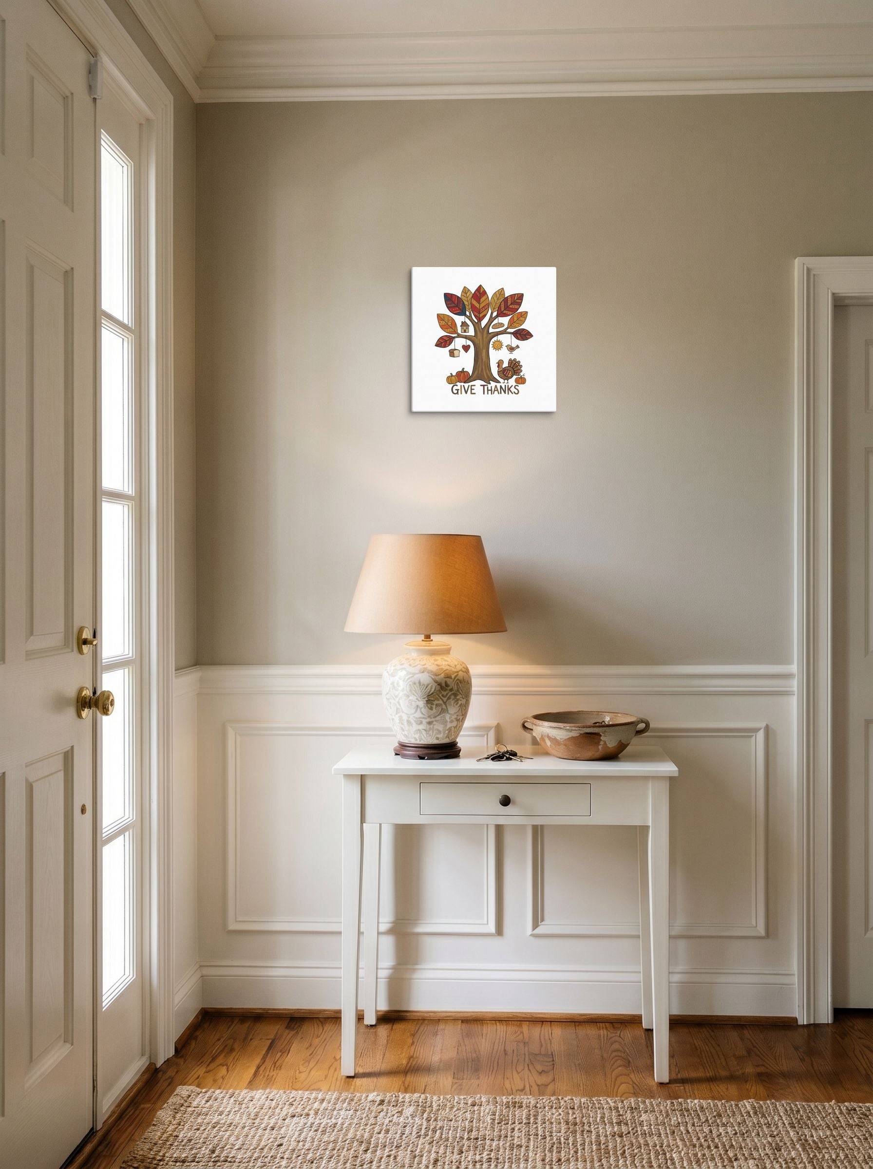 A 12x12 inch canvas Naive art print of 'Tree of Gratitude' hanging in an entryway near a console.
