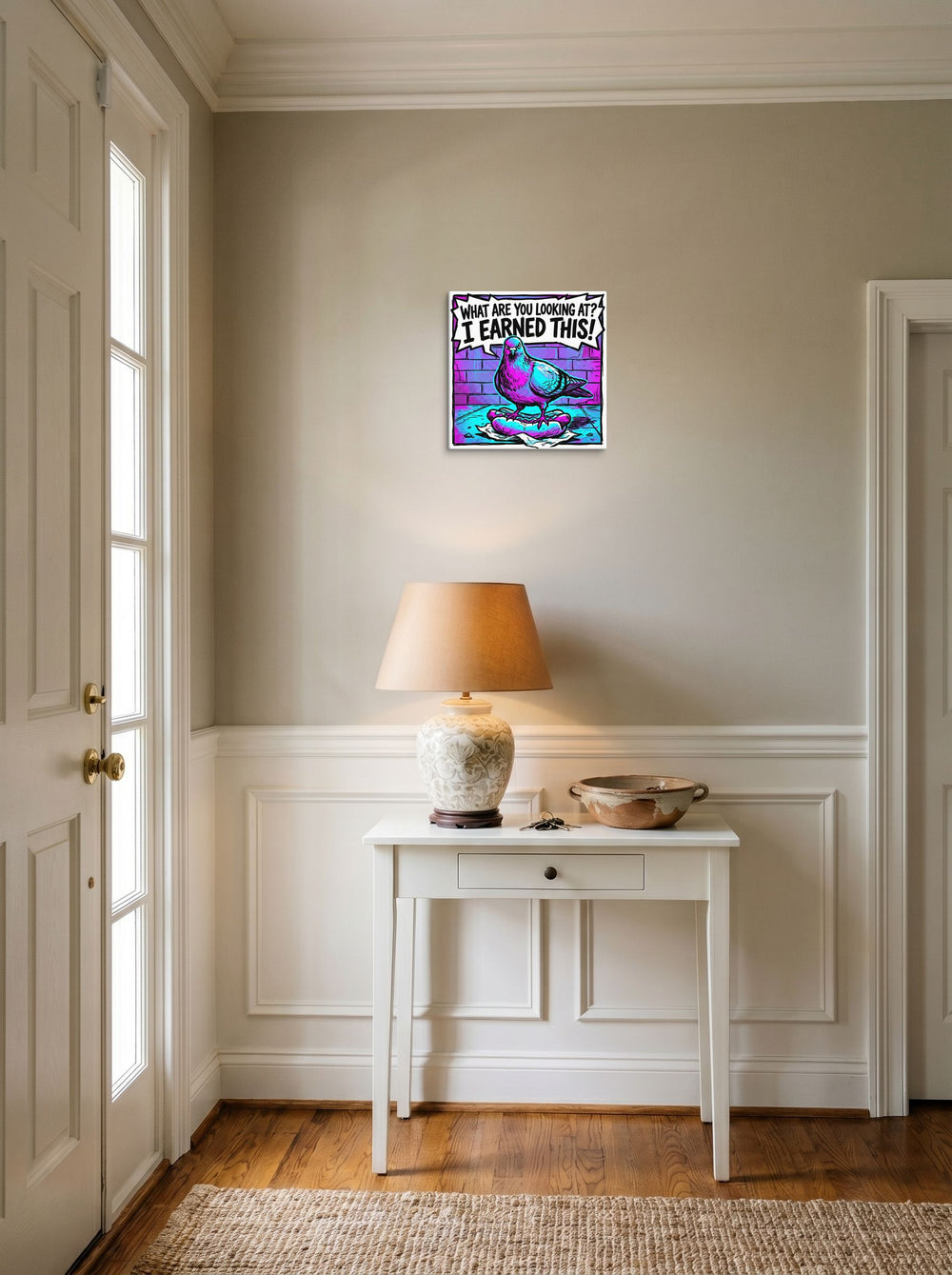 A 12x12 inch canvas Pop art print of 'The Victorious Pigeon' hanging in an entryway near a console.