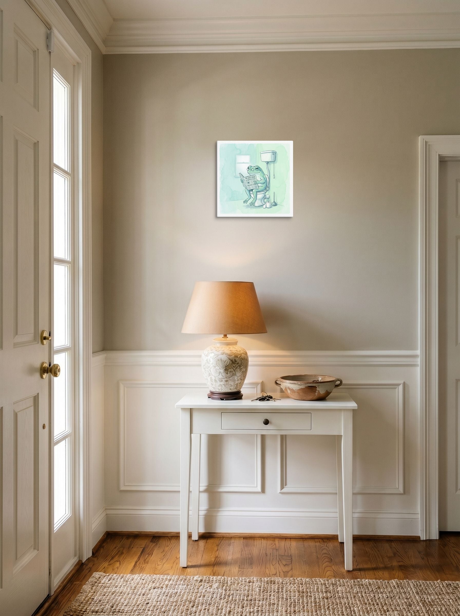 A 12x12 inch canvas Realism print of 'The Daily Croak' hanging in an entryway near a console.