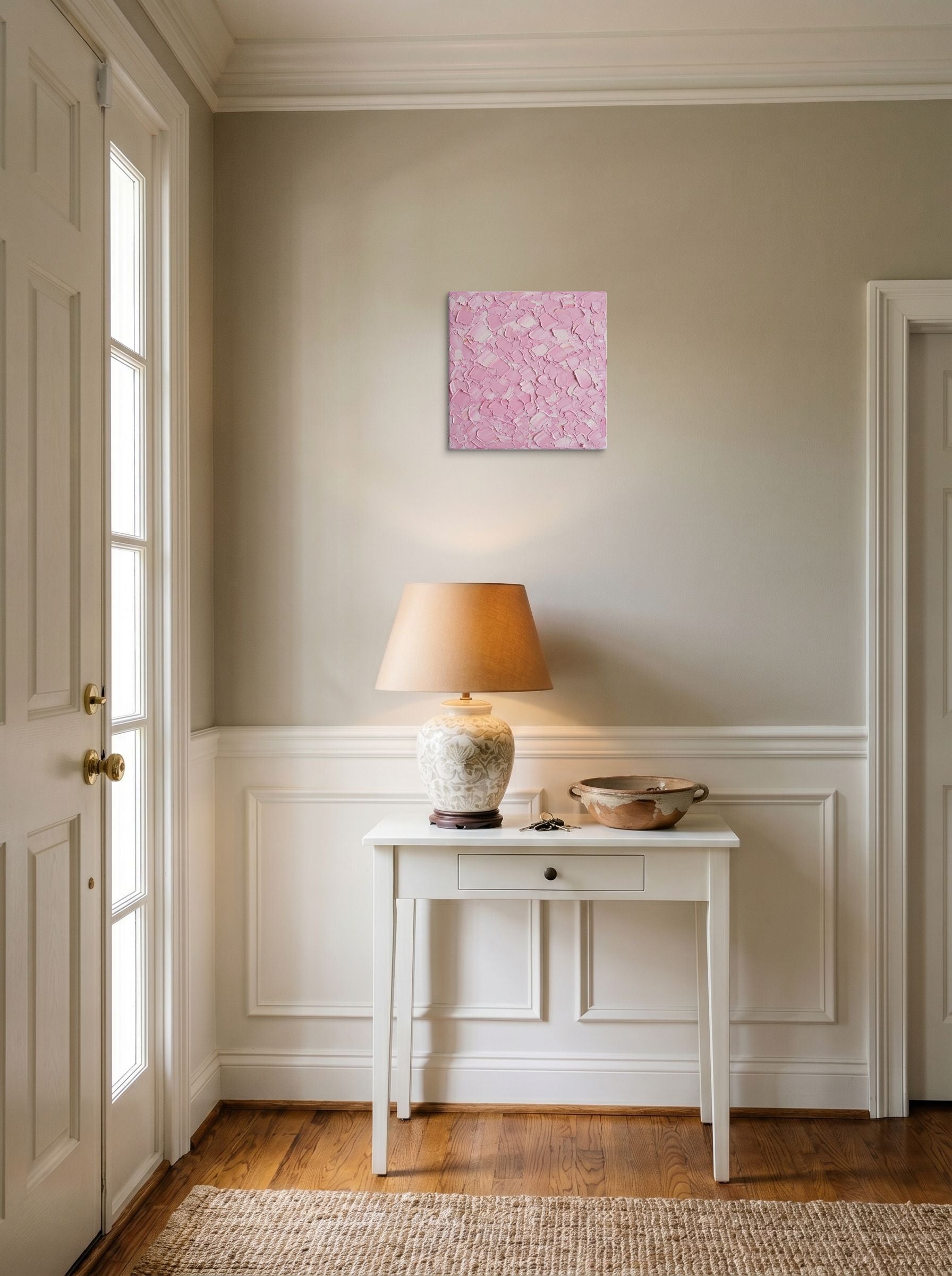 A 12x12 inch canvas Expressionism print of 'Blush Topography' hanging in an entryway near a console.