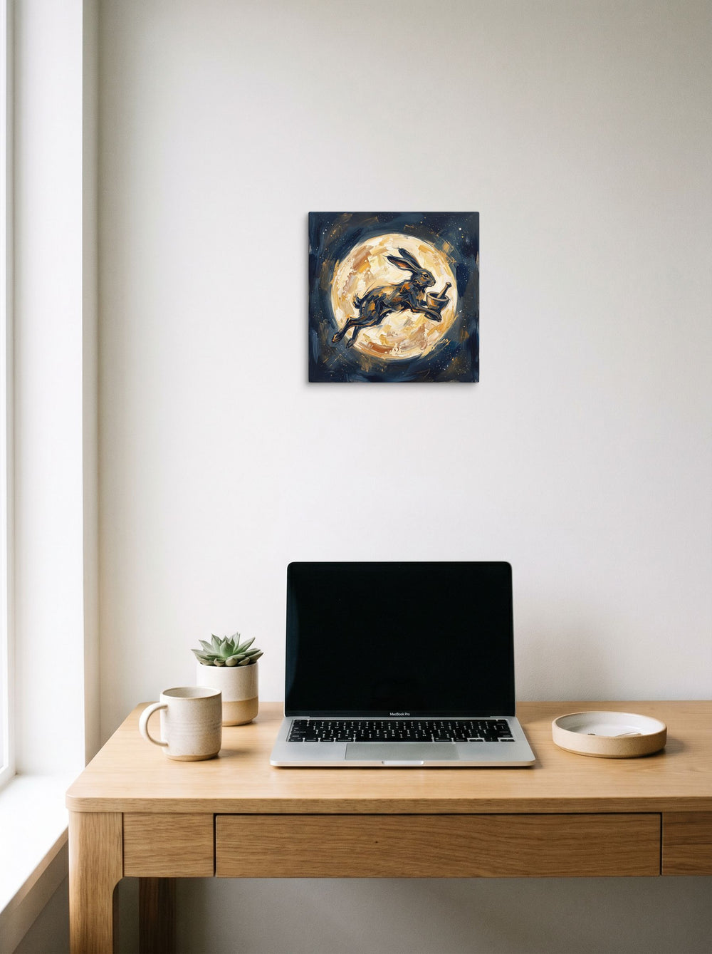 A 12x12 inch canvas Expressionism print of 'Celestial Hare', styled above a home-office workspace.