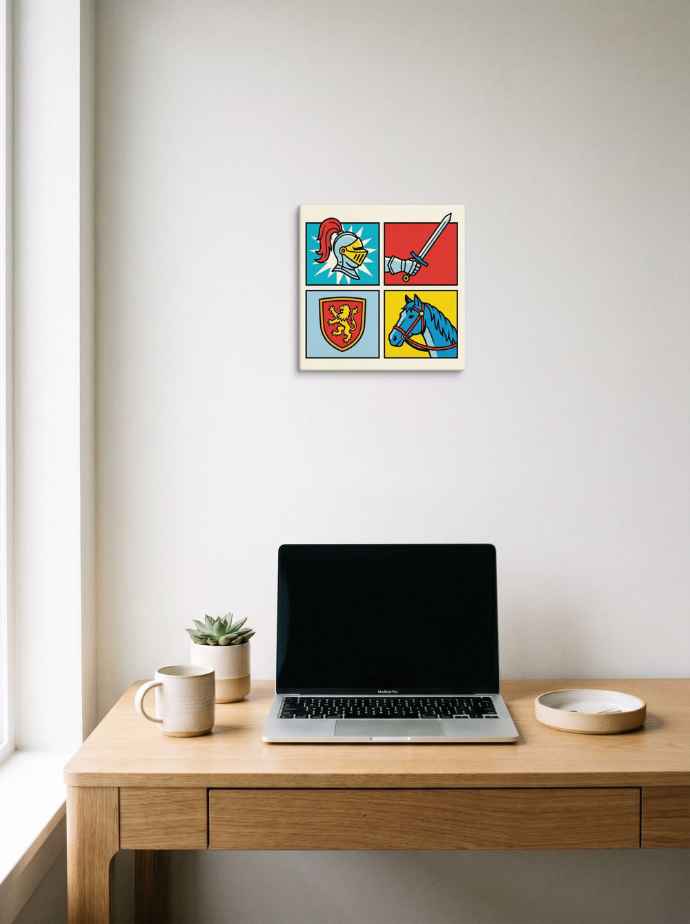 A 12x12 inch canvas Pop art print of 'Chivalric Pop Grid' hanging above a worktable with a laptop.