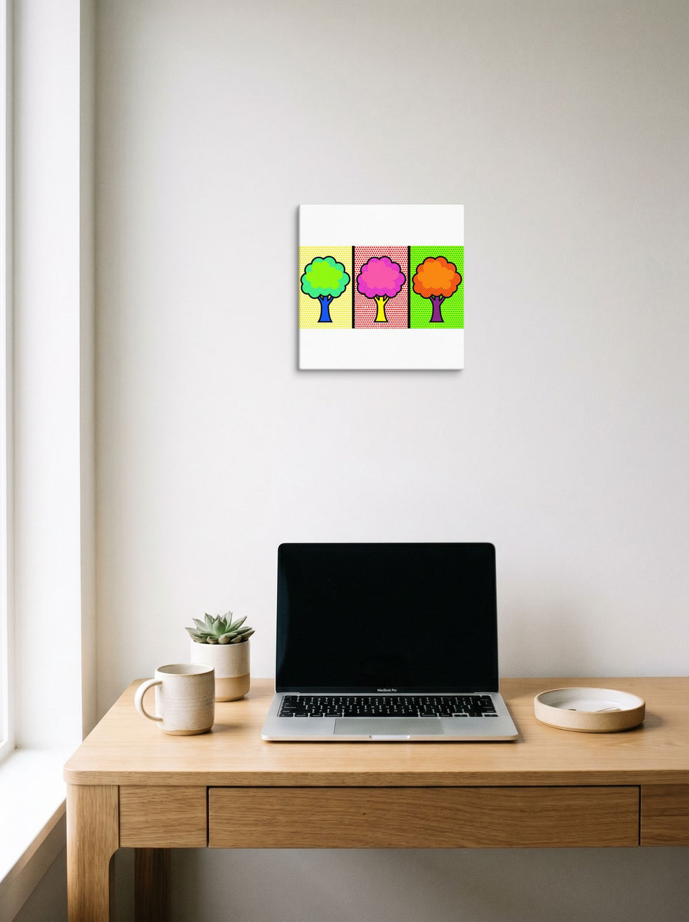 A 12x12 inch canvas Pop art print of 'Pop Art Canopy Triptych' hanging above a worktable with a laptop.