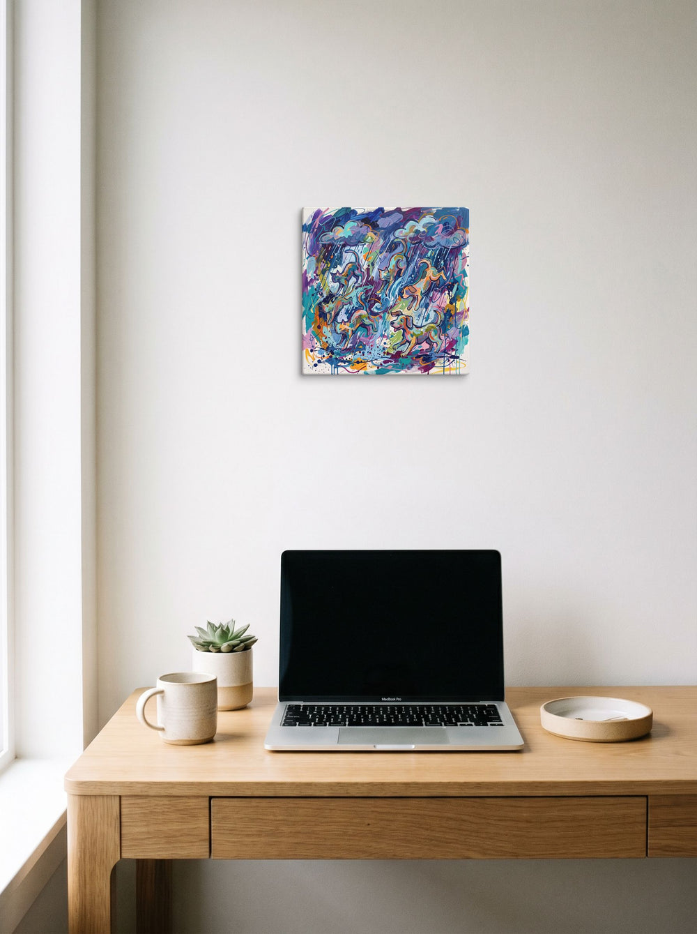 'Raining Cats and Dogs' in 12x12 inch canvas, displayed over a compact desk setup.