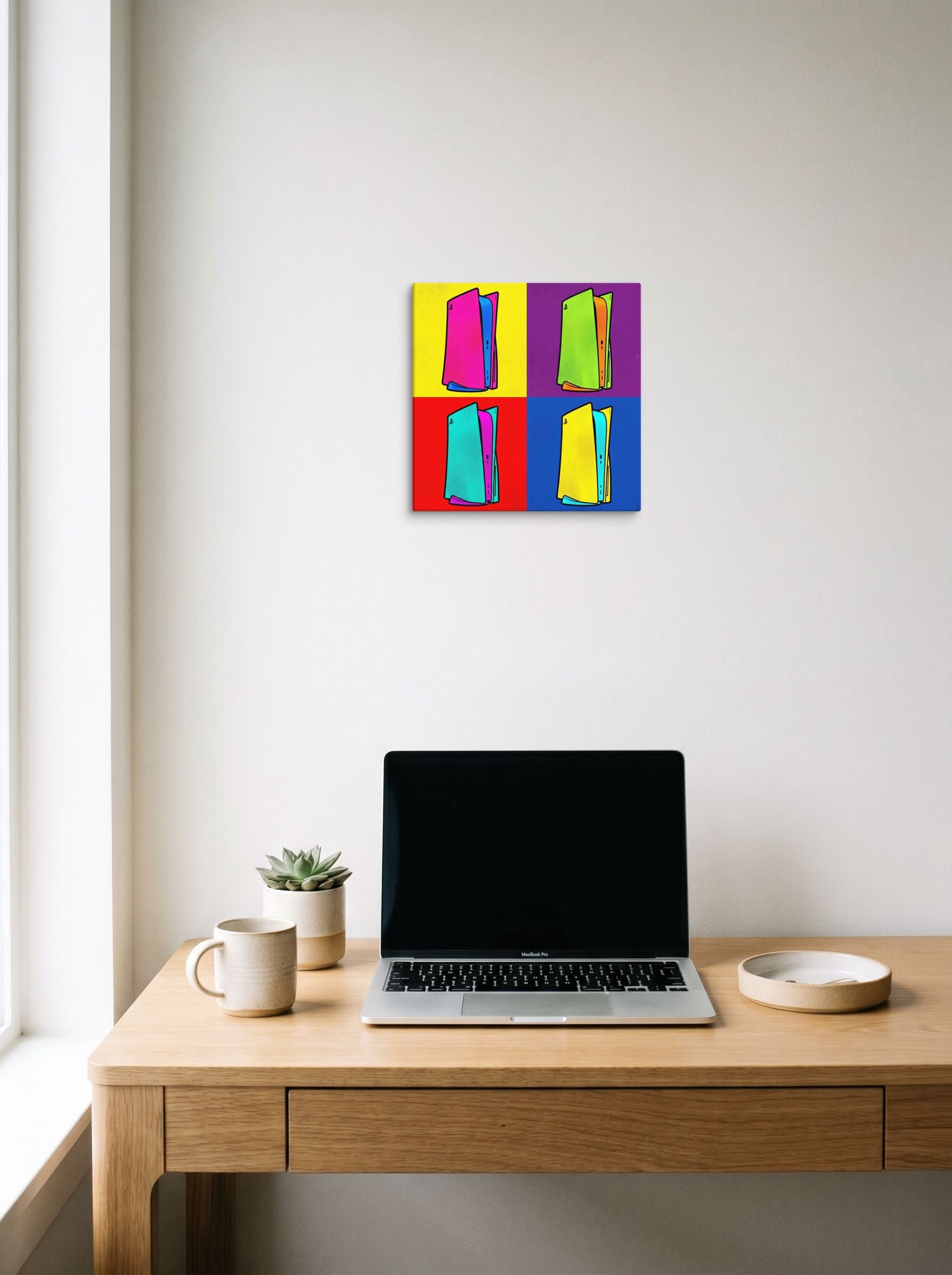 A 12x12 inch canvas Pop art print of 'Next Gen Chroma' hanging above a worktable with a laptop.