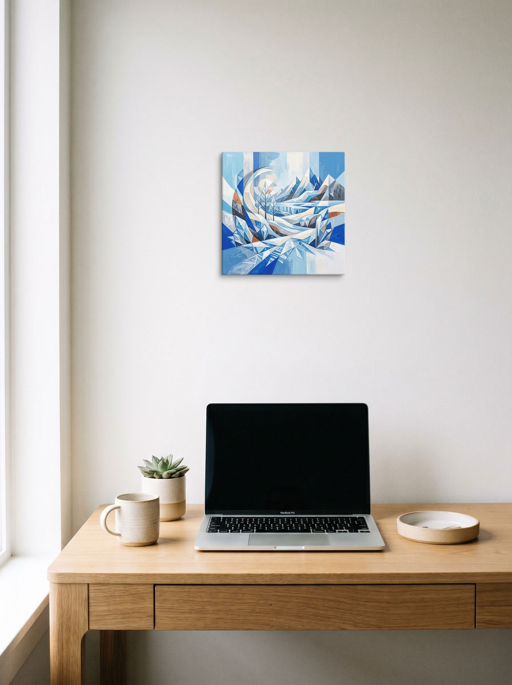 The Crystal Cubism print 'Crystalline Alpine Haven', 12x12 inch canvas, styled above a home-office workspace.