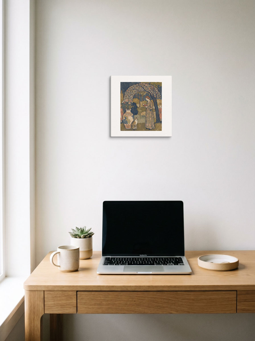 'Under the Trellis', a Les Nabis print hanging above a worktable with a laptop. Shown as canvas, 12x12 inch.
