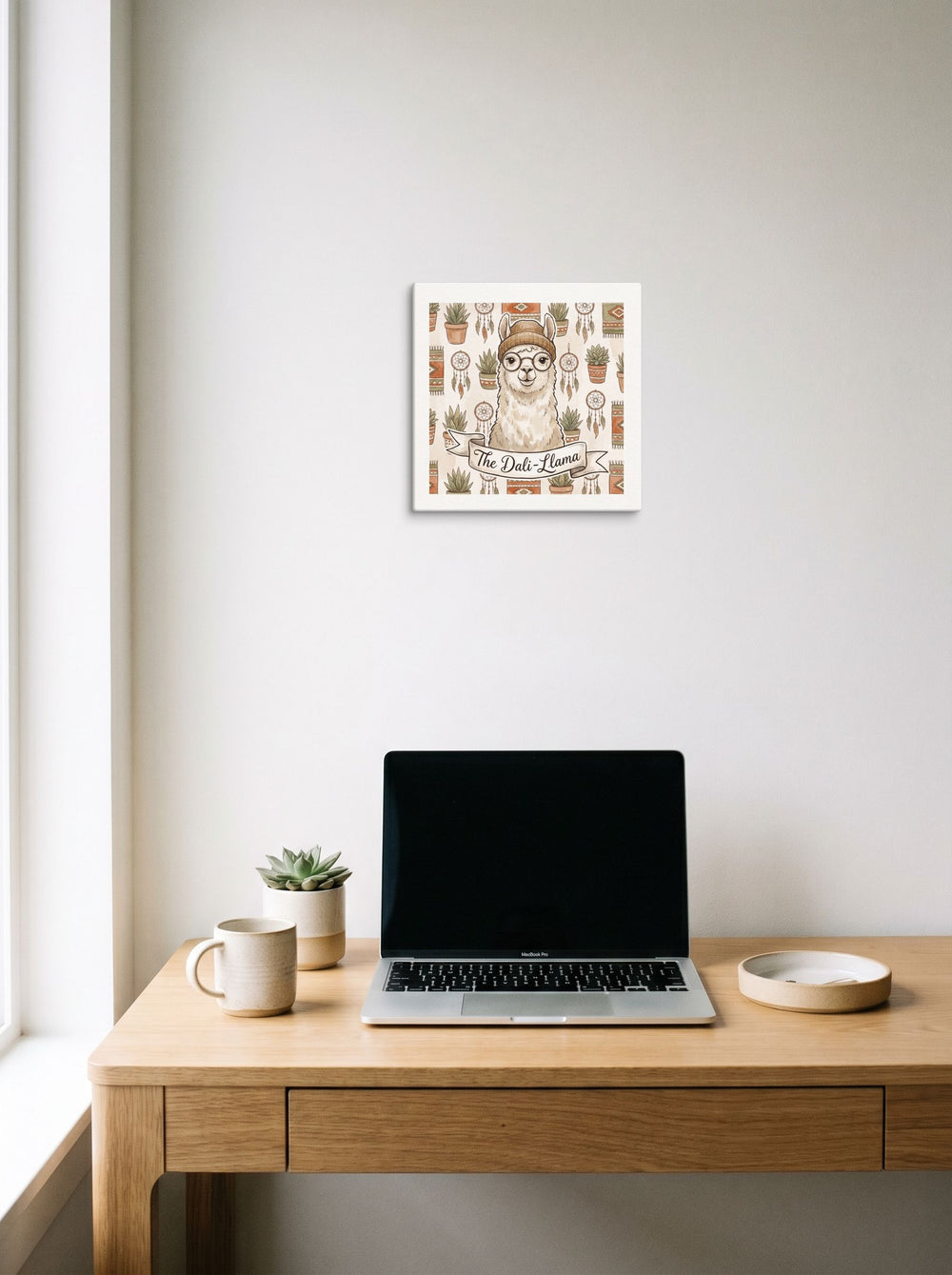 The canvas print 'The Dali-Llama' displayed over a compact desk setup, shown at 12x12 inch.