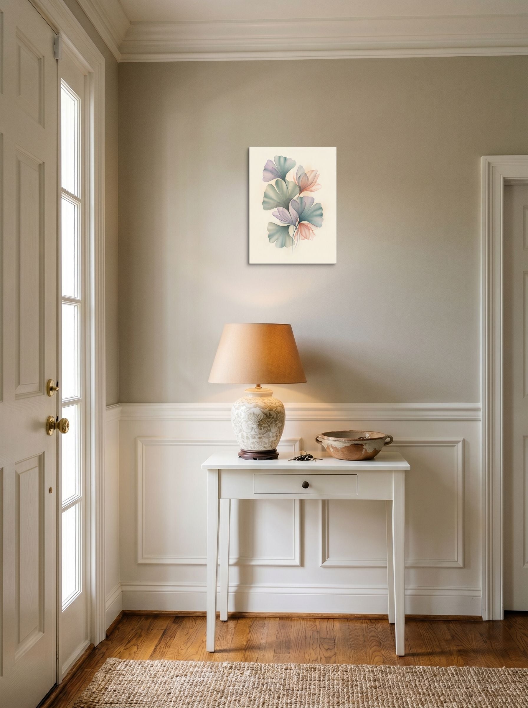 A 12x16 inch canvas Abstract art print of 'Ethereal Ginkgo Whispers' hanging in an entryway near a console.