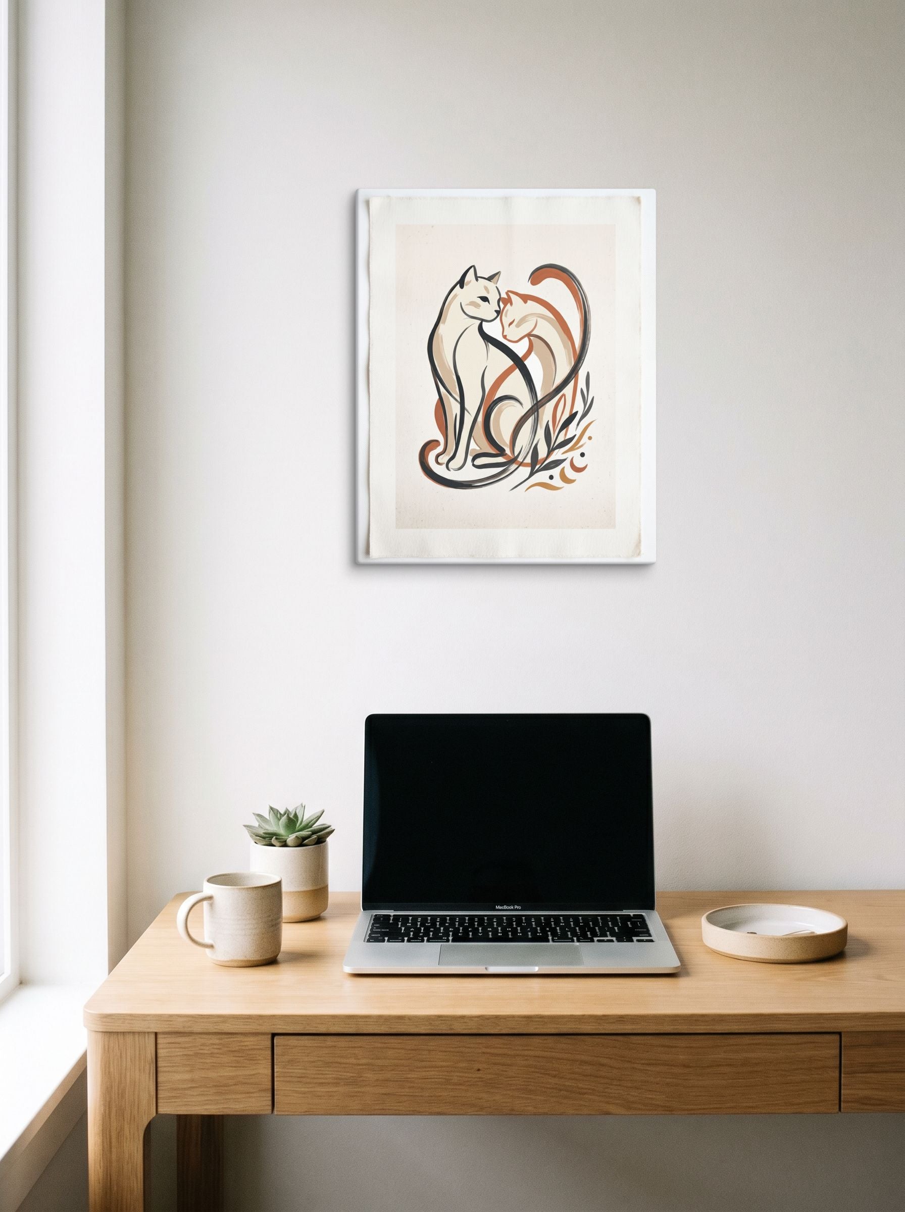 A 16x20 inch canvas Minimalism,Abstract art print of 'Feline Affection' hanging above a worktable with a laptop.