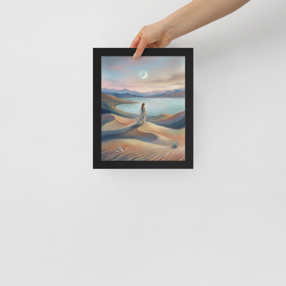 'Desert Moonrise' — a Magic realism print. A woman in a flowing dress standing on rolling sand dunes looking over a turquoise bay toward mountains under a twilight sky with a crescent moon.