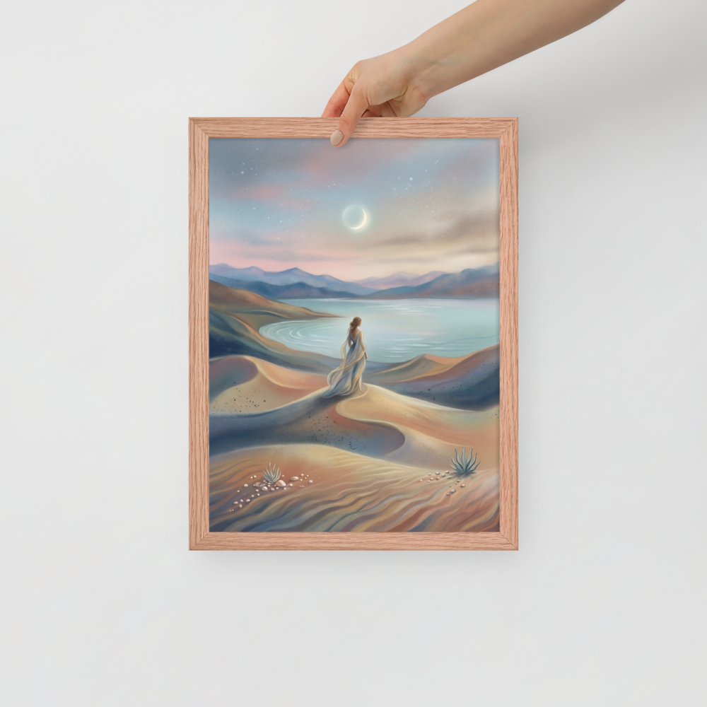 'Desert Moonrise' — a Magic realism print. A woman in a flowing dress standing on rolling sand dunes looking over a turquoise bay toward mountains under a twilight sky with a crescent moon.