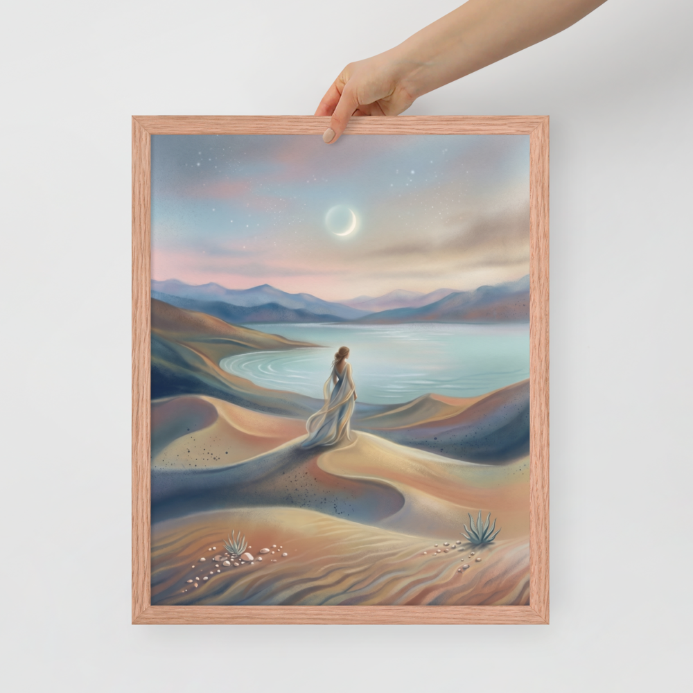 'Desert Moonrise' — a Magic realism print. A woman in a flowing dress standing on rolling sand dunes looking over a turquoise bay toward mountains under a twilight sky with a crescent moon.