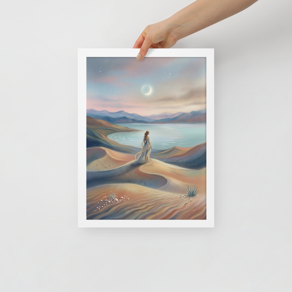 'Desert Moonrise' — a Magic realism print. A woman in a flowing dress standing on rolling sand dunes looking over a turquoise bay toward mountains under a twilight sky with a crescent moon.