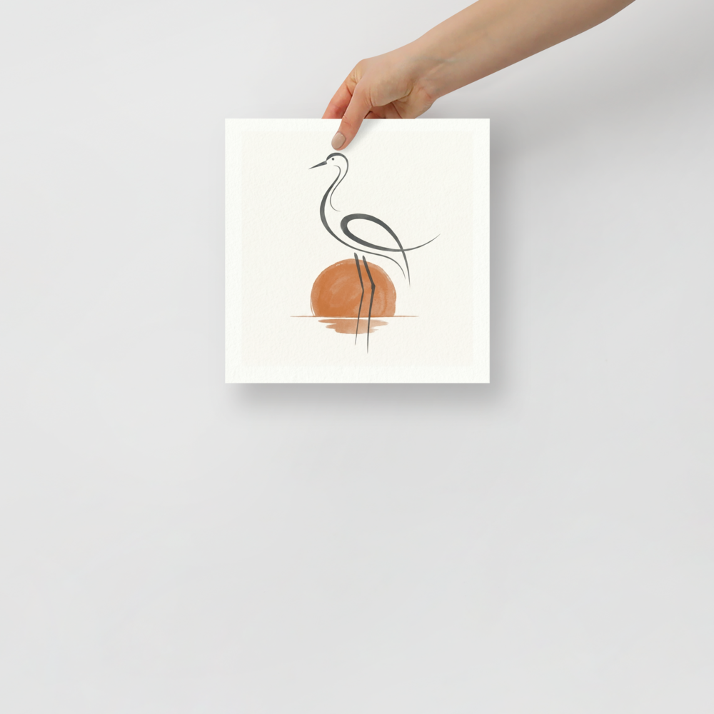 'Heron at Sunset' — a Minimalism,Modern European ink painting print. A minimalist line drawing of a heron standing in water against a watercolor orange sun, set on a textured white background. Ideal for a calming bathroom or bedroom.