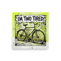 'Two Tired' — a Pop art print. A comic book style pop art illustration of a bicycle against a brick wall with lime green accents and a speech bubble reading 'I\'M TWO TIRED!', perfect for a home gym or garage.