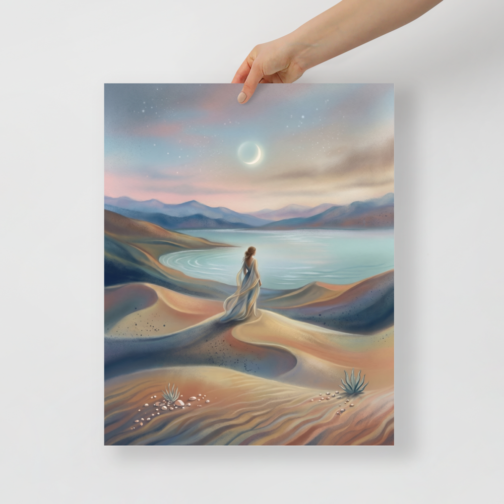 'Desert Moonrise' — a Magic realism print. A woman in a flowing dress standing on rolling sand dunes looking over a turquoise bay toward mountains under a twilight sky with a crescent moon.