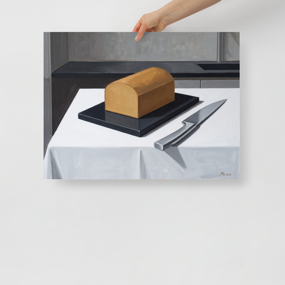 'The Morning Loaf' — a Art Deco print. A minimalist Art Deco oil painting of a golden loaf of bread and a silver knife on a crisp white table, perfect for a modern kitchen.
