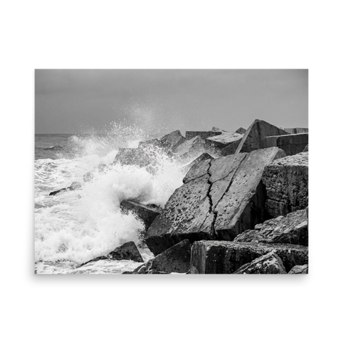 'Breakwater Surge' — a Art photography print. Monochrome ocean spray crashing against geometric stone blocks, ideal coastal decor for a modern office.