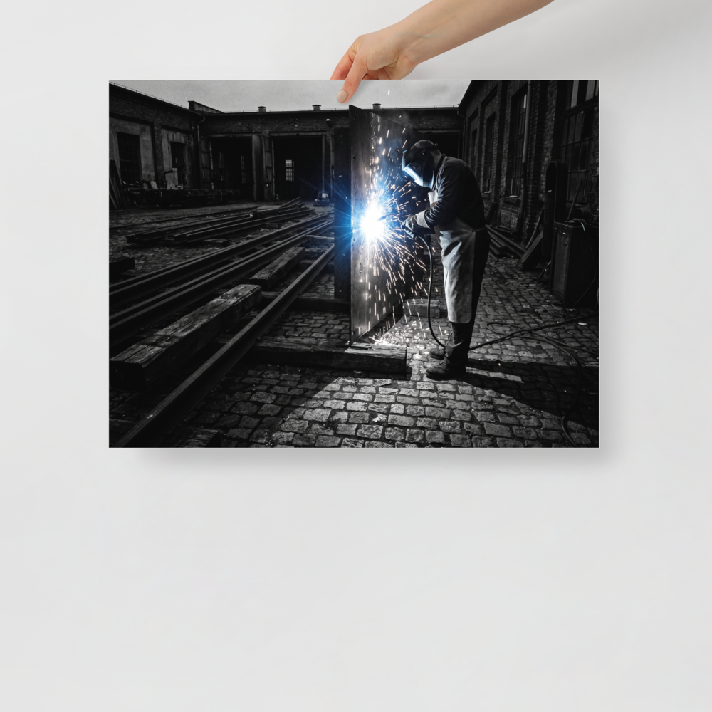 'Sparks of Labor' — a Art photography print. Dramatic high-contrast photograph of a welder generating brilliant sparks in an industrial yard, great for a garage or study.