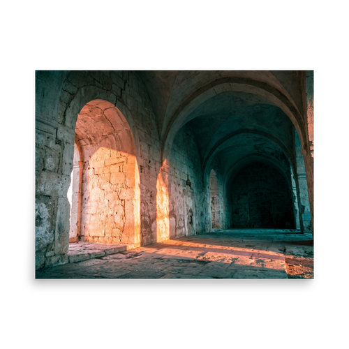 'Arches at Sunset' — a Art photography print. Ancient stone arches illuminated by warm sunset light with cool shadowed corridors, elegant architectural art for a hallway.