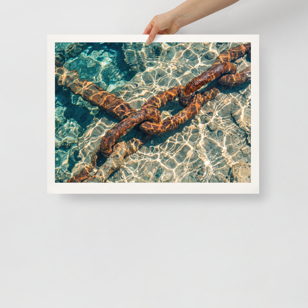 'Sunken Mooring Chain' — a Art photography print. Rusted iron mooring chain submerged in crystal clear turquoise ocean water with dancing sun ripples, ideal coastal art for a bathroom.