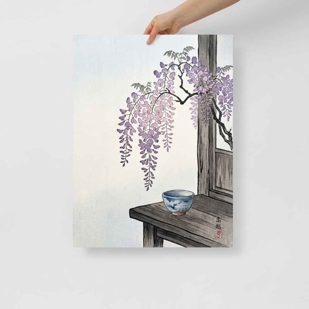 'Wisteria and Tea' — a Shin hanga print. Cascading purple wisteria blossoms hang above a traditional blue ceramic tea bowl on a rustic wooden table, ideal for a serene dining room.