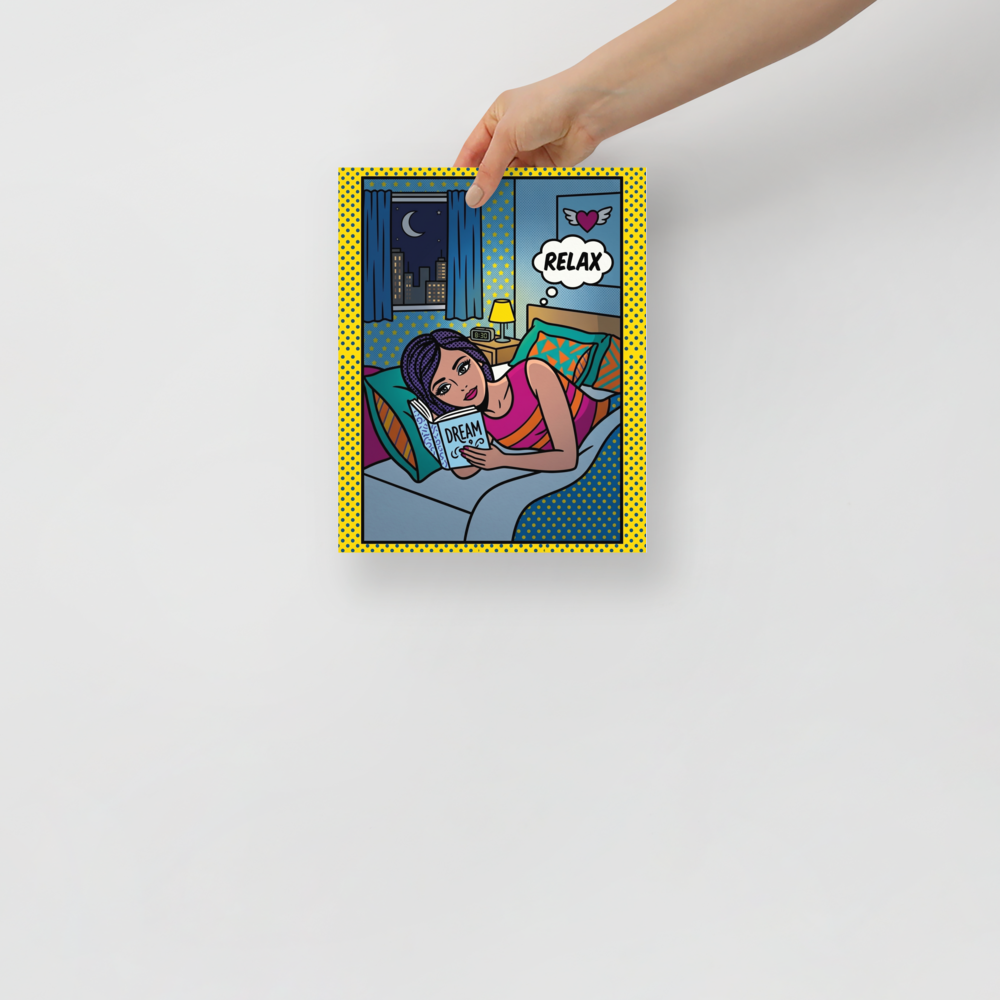 'Relax and Dream' — a Pop art print. A comic-style pop art illustration of a woman reading a book titled DREAM in bed, with a thought bubble saying RELAX, perfect for a cozy bedroom.