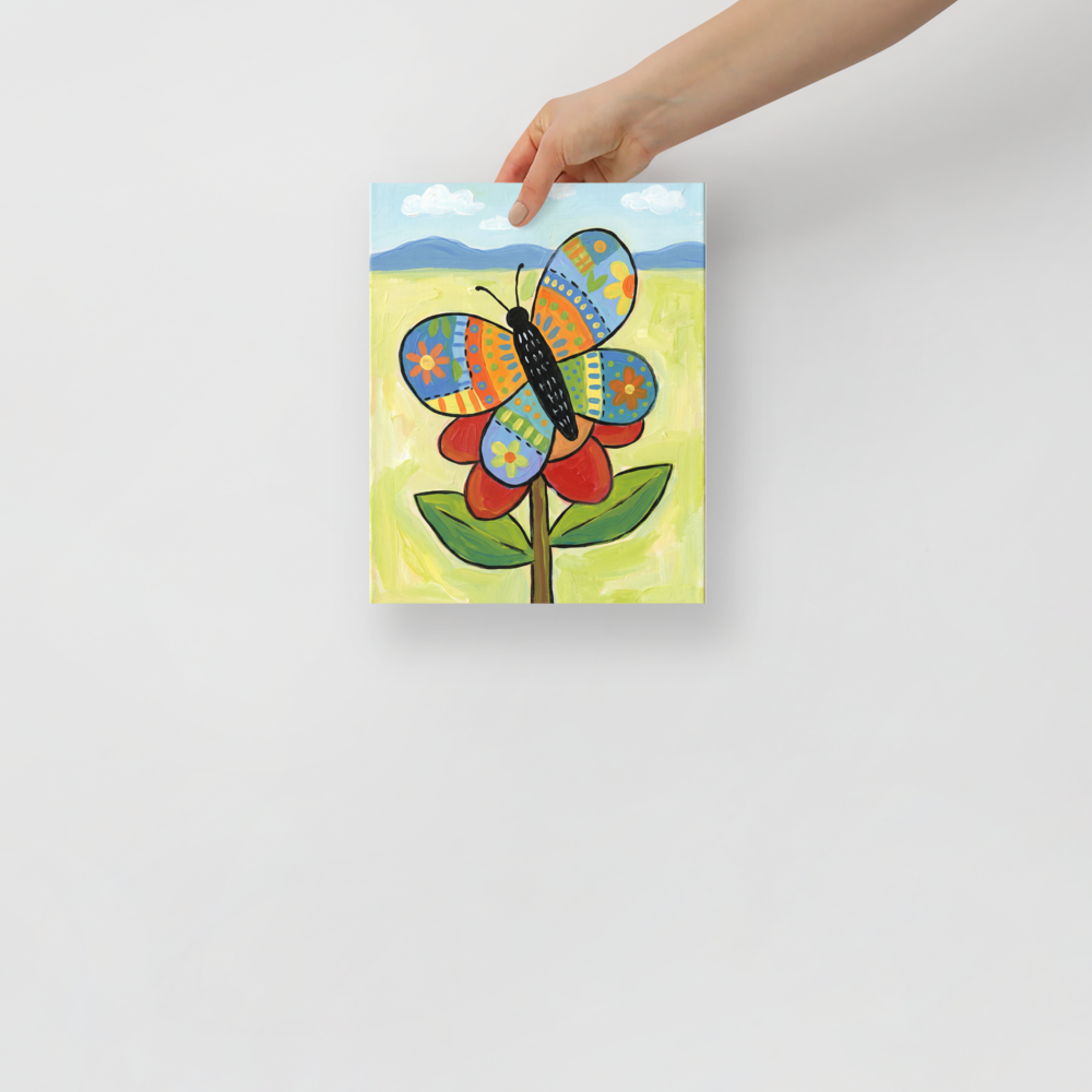 'The Patchwork Butterfly' — a Naive art print. A colorful, patchwork-style butterfly resting on a red flower in a bright meadow, perfect for a cheerful nursery or sunroom.