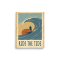 'Ride the Tide' — a Pop art,Digital art print. A vintage illustration of a surfer riding a large wave against a warm sunset with the text 'Ride The Tide', a nostalgic piece for a Living Room.