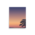 'Twilight Tranquility' — a Digital art,Minimalism print. A serene landscape with a vibrant purple and orange sunset over a lake and the silhouette of a tree, perfect for a Bedroom.