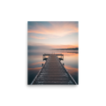 'Pastel Dawn Pier' — a Art photography print. Symmetrical landscape photograph of a wooden dock extending into a calm, misty lake reflecting a colorful sunrise, perfect for a peaceful bedroom or office space.