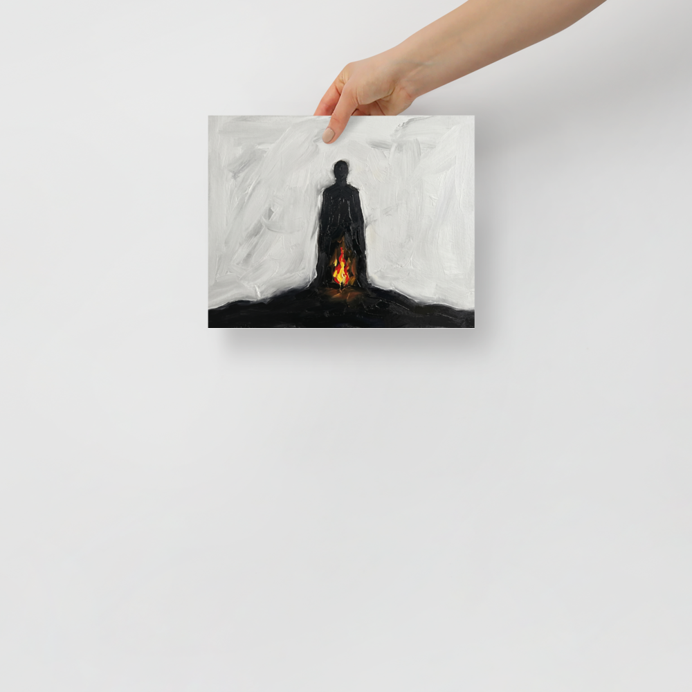 'Inner Flame' — a Minimalism,Expressionism print. A minimalist painting of a black silhouetted figure standing against a white background with a small fire burning at their feet, ideal for a modern Living Room or Office.