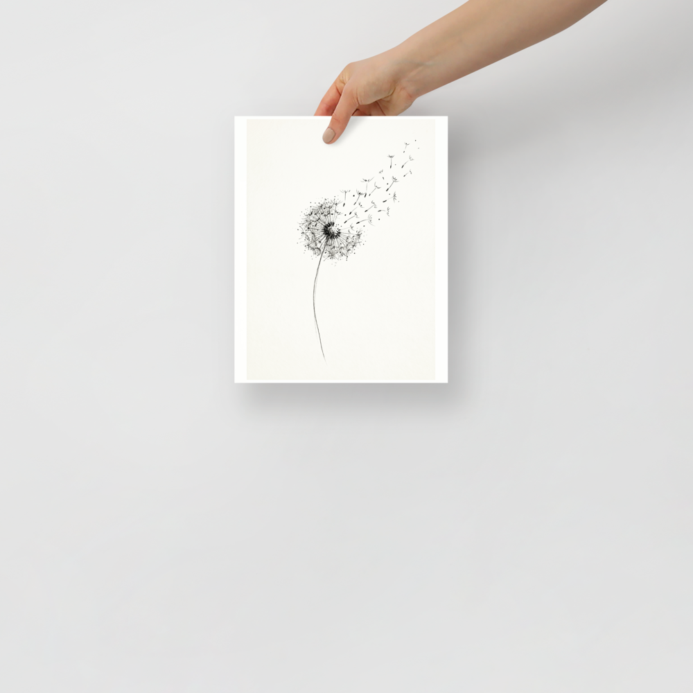 'Whispering Wishes' — a Minimalism print. A delicate black and white ink drawing of a dandelion with its seeds blowing away in the wind, perfect for a peaceful bedroom or nursery.