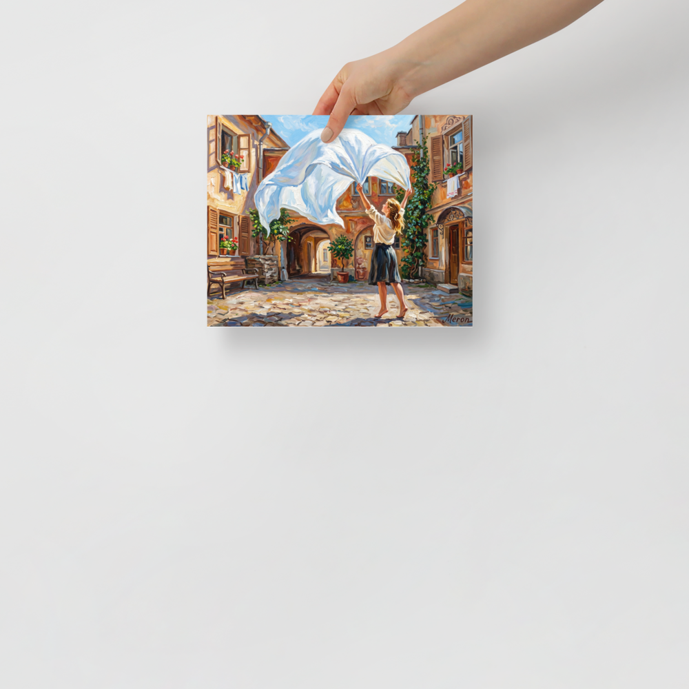 'The White Sheet' — a Impressionism print. A barefoot woman in a skirt hangs a large white sheet in a sunlit cobblestone courtyard, a perfect piece for a sunny kitchen or laundry room.