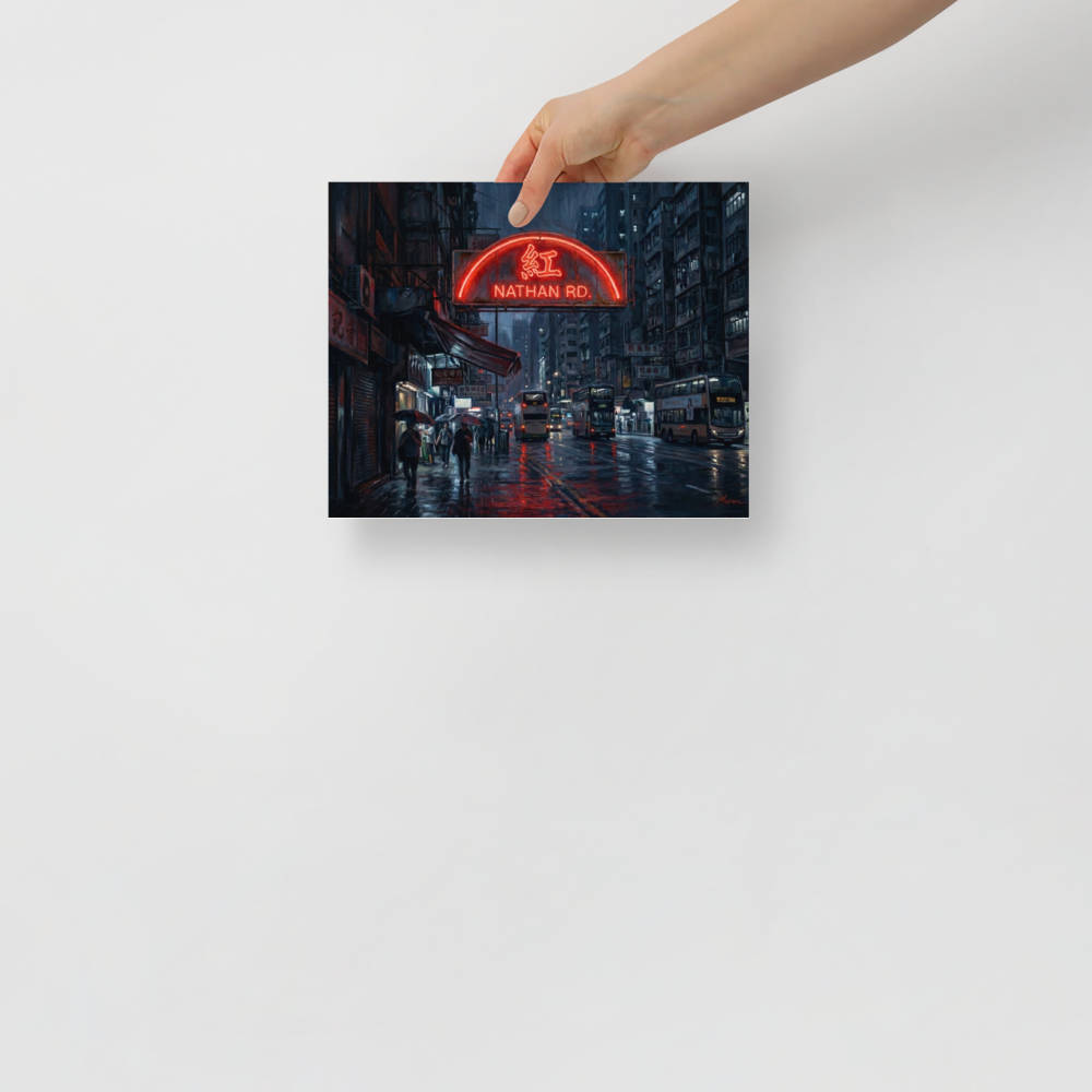 'Rainy Night on Nathan Road' — a Realism print. A vibrant red neon sign reading Nathan Rd glows over a rainy street corner in Hong Kong, with double decker buses and people holding umbrellas, perfect for an office or living room.