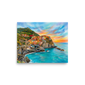 'Coastal Dreams' — a Realism,Romanticism print. A vibrant airbrush painting of a colorful cliffside coastal village overlooking turquoise ocean waters at sunset, perfect for a sunroom or bedroom.