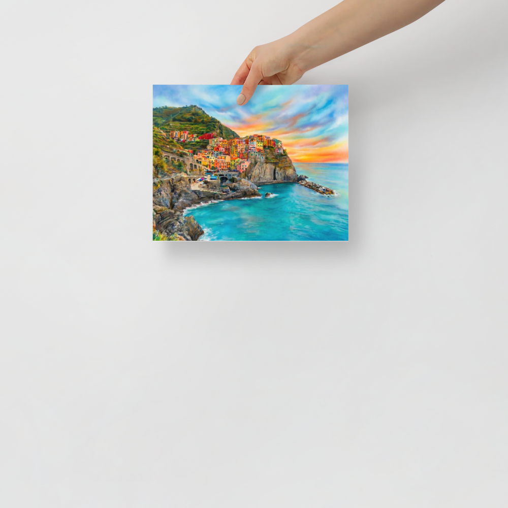 'Coastal Dreams' — a Realism,Romanticism print. A vibrant airbrush painting of a colorful cliffside coastal village overlooking turquoise ocean waters at sunset, perfect for a sunroom or bedroom.