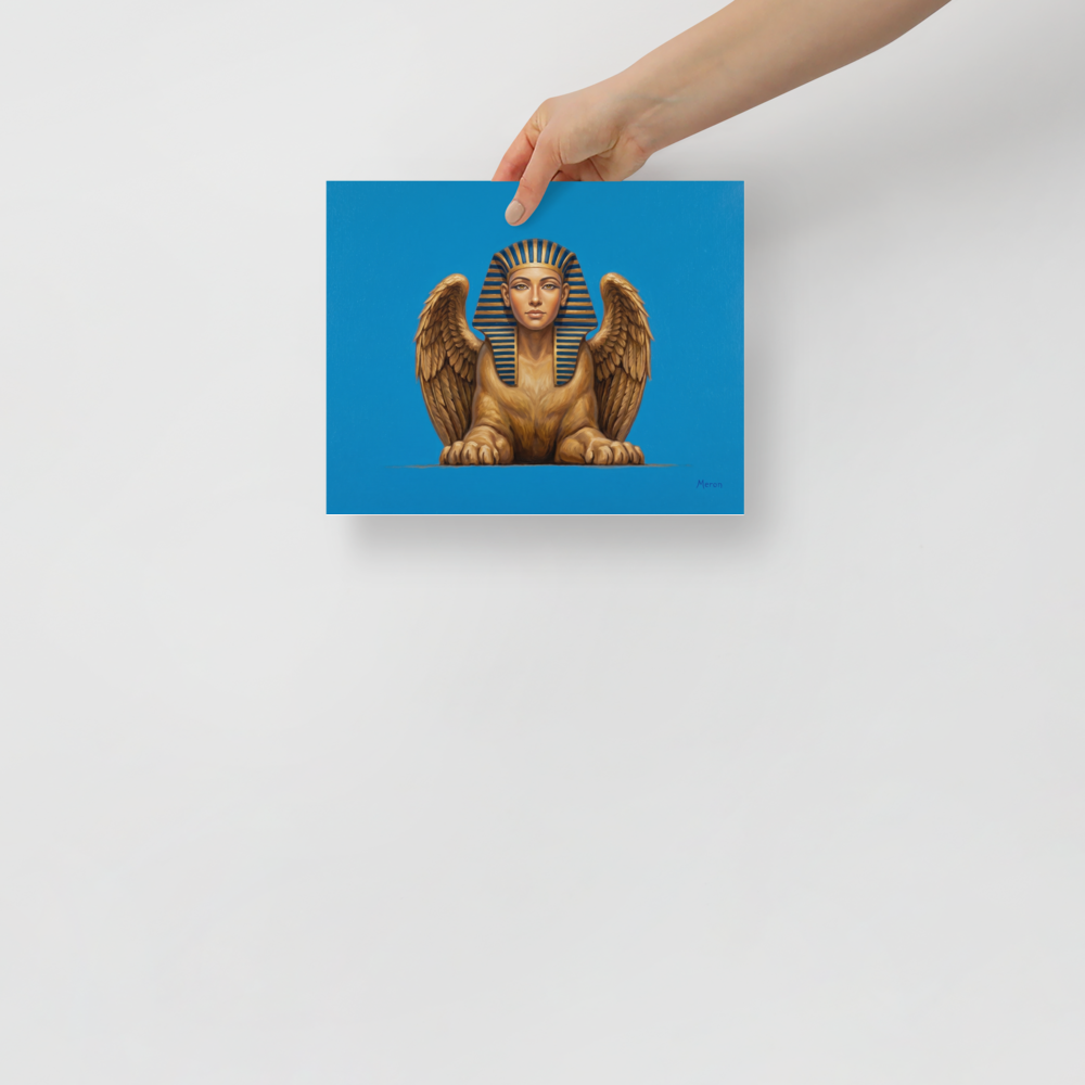 'The Golden Sphinx' — a Realism print. A detailed painting of a golden winged sphinx with a pharaoh's headdress set against a bright blue background, ideal for an Office.