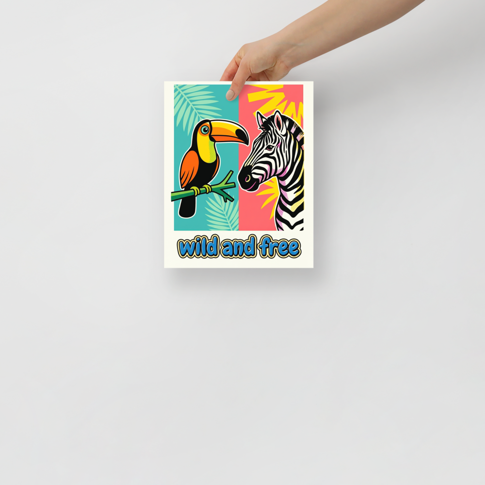 'Wild and Free Toucan Zebra' — a Pop art print. A split background pop art poster featuring a toucan on the left and a zebra on the right with the text wild and free, perfect for a lively nursery or playroom.