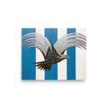 'Deco Eagle in Flight' — a Art Deco print. A stylized geometric painting of an eagle with silver wings and a bronze body flying against blue and white vertical stripes, perfect for an Office or Boy's Room.