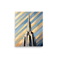 'The Metropolis Spire' — a Art Deco print. An oil painting of a towering Art Deco skyscraper piercing a dynamic, diagonal striped sky of blue and gold, great for an office or study.