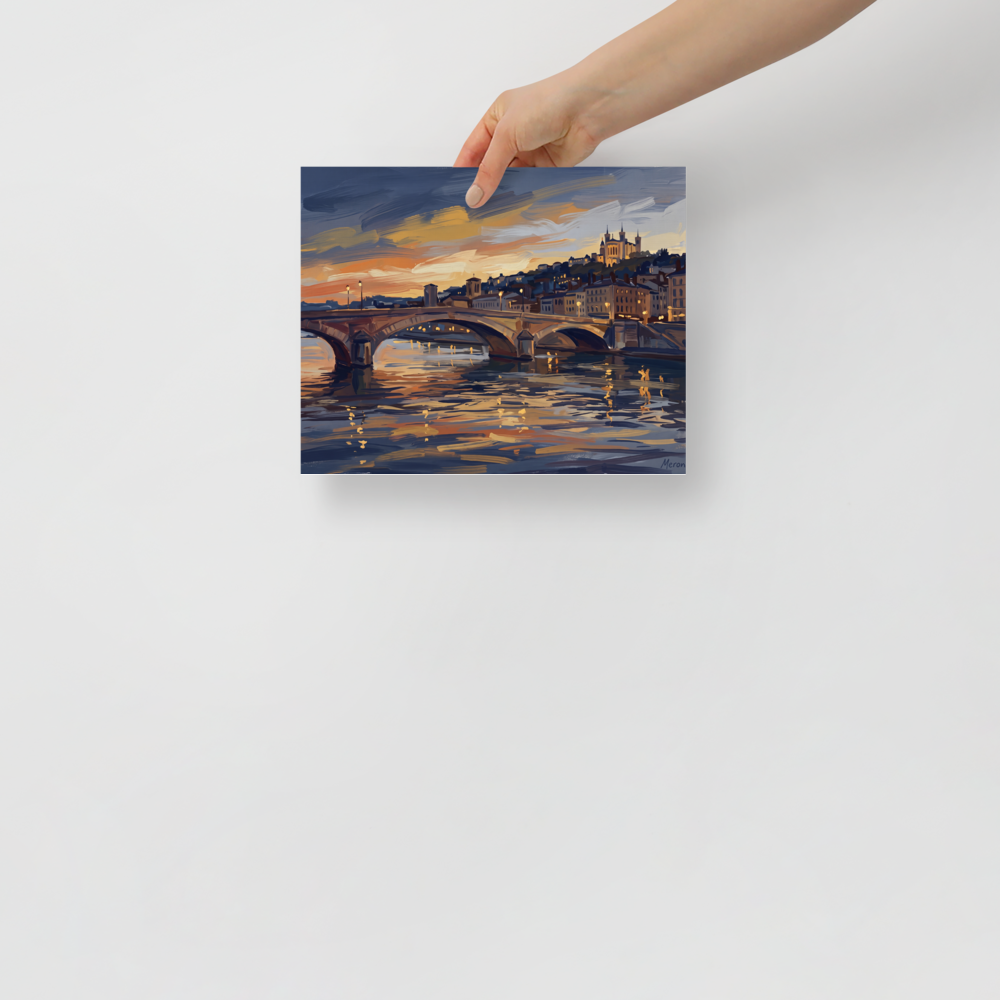 'Dusk Over Lyon' — a Impressionism print. An oil painting of a French city scene at sunset with a stone arched bridge over a glowing river, creating a peaceful atmosphere perfect for a living room or bedroom.