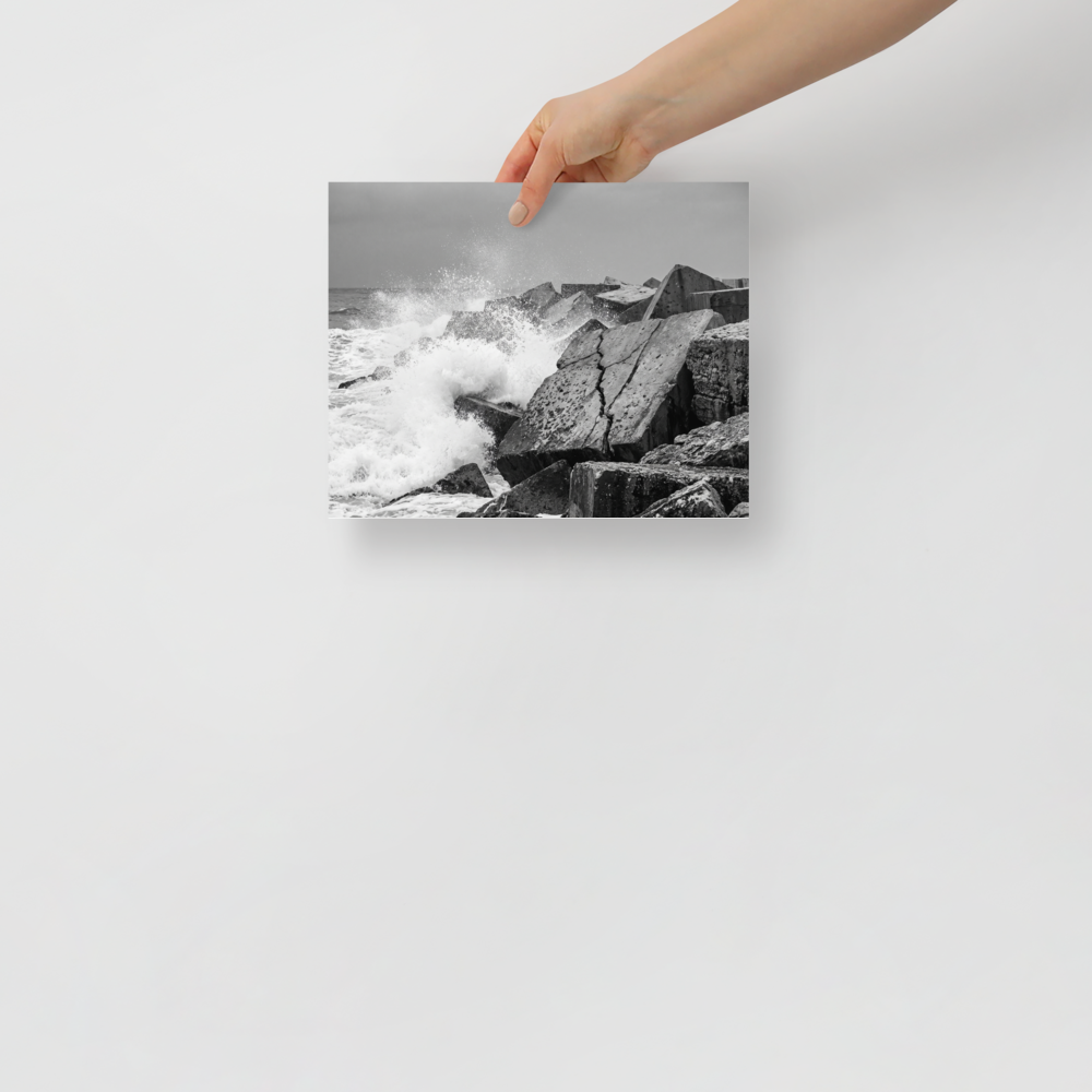 'Breakwater Surge' — a Art photography print. Monochrome ocean spray crashing against geometric stone blocks, ideal coastal decor for a modern office.