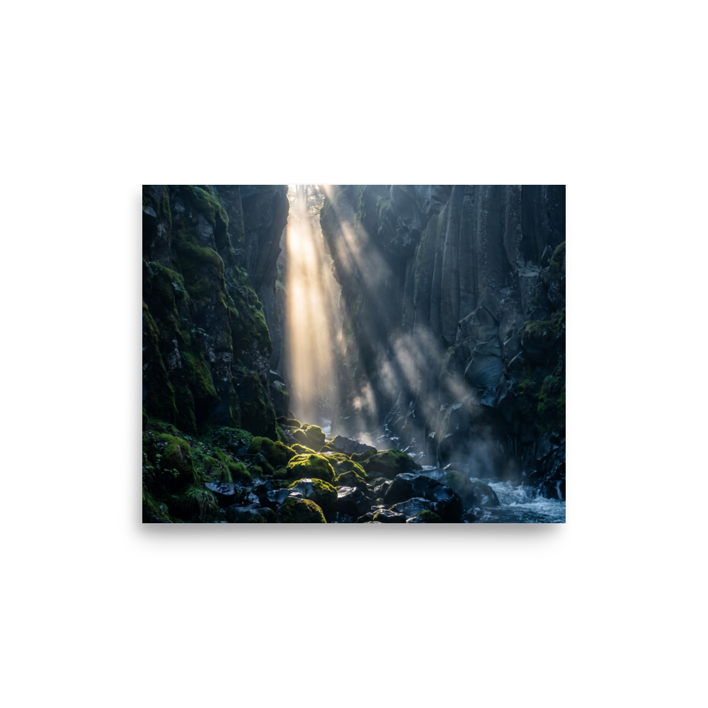 'Sunbeams in the Gorge' — a Art photography print. Golden sunbeams filtering down into a mossy volcanic canyon gorge, serene nature decor for a calming bedroom.