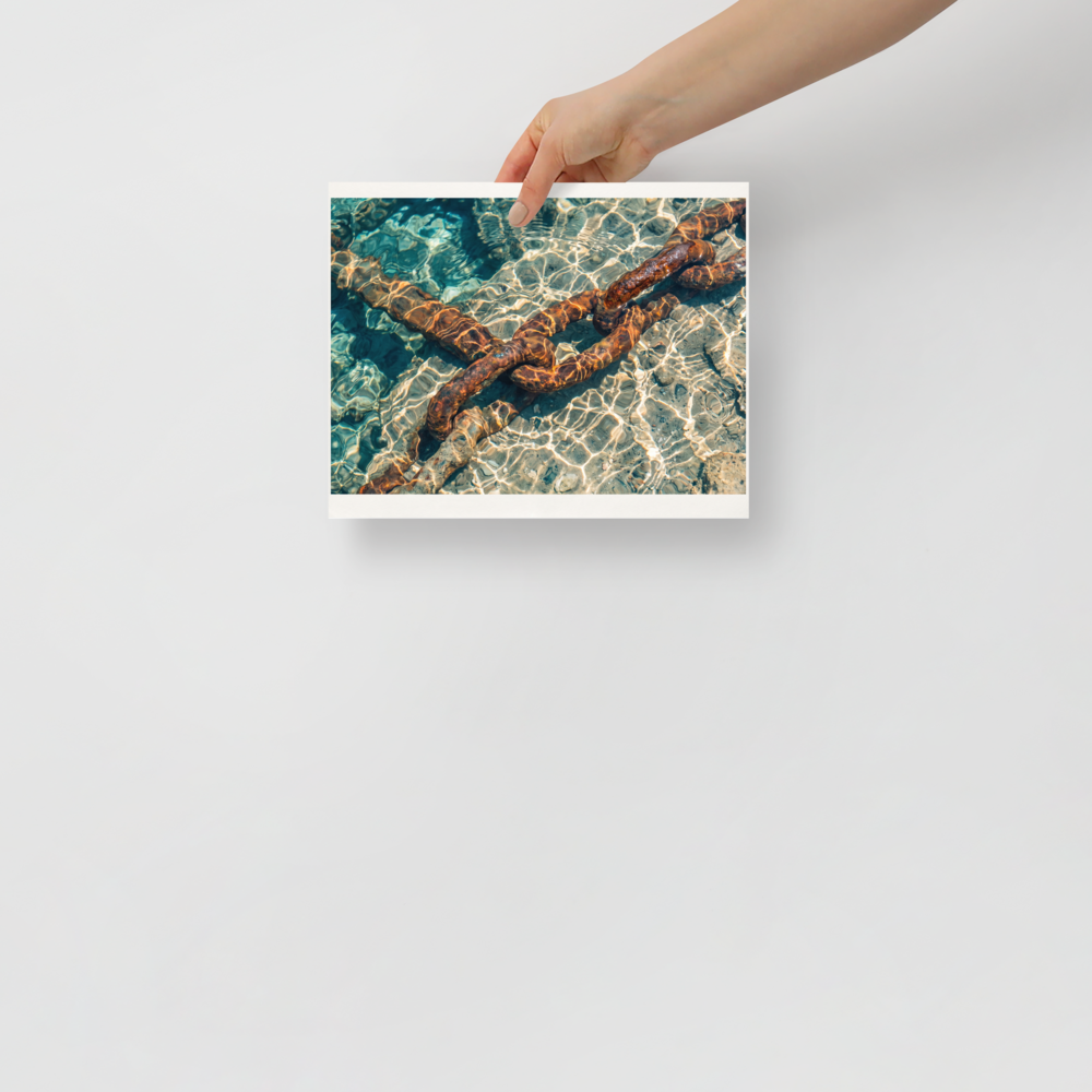 'Sunken Mooring Chain' — a Art photography print. Rusted iron mooring chain submerged in crystal clear turquoise ocean water with dancing sun ripples, ideal coastal art for a bathroom.