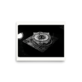 'Concentric Resonance' — a Art photography print. A dramatic black and white photograph capturing concentric water ripples above a textured stone, well suited for a modern office or living room.